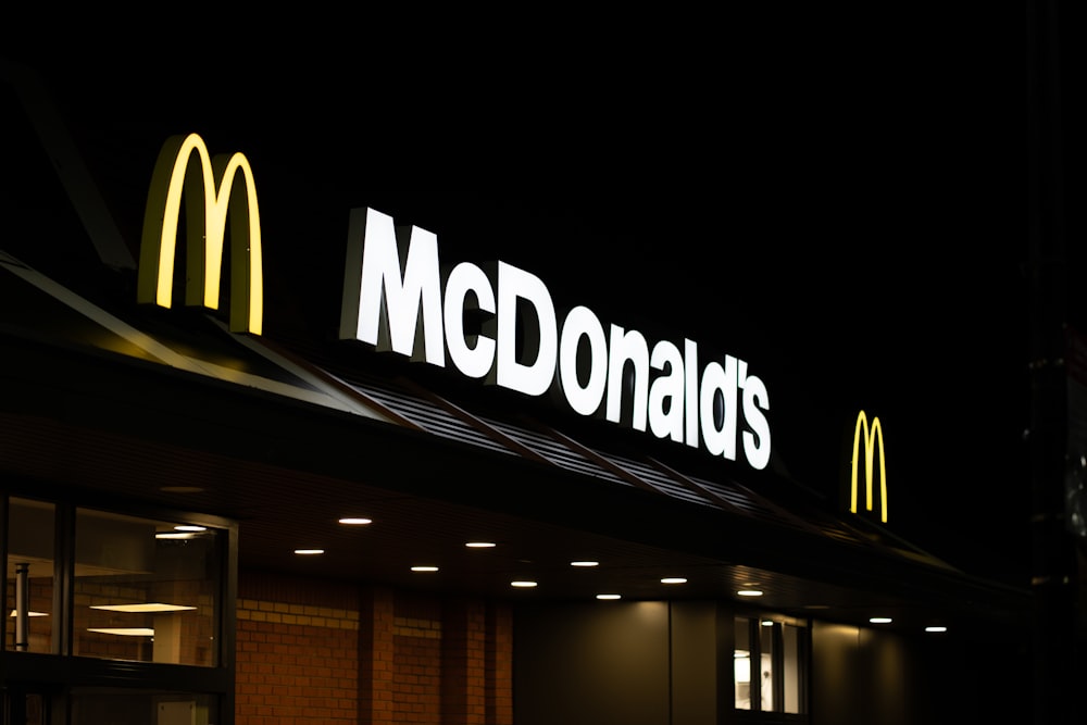a mcdonald's restaurant lit up at night