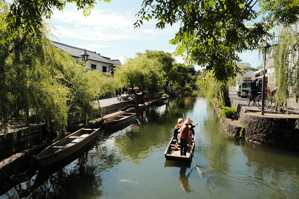 a person in a small boat on a river