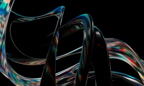A dynamic 3D animation of swirling colorful ribbons against a dark background
