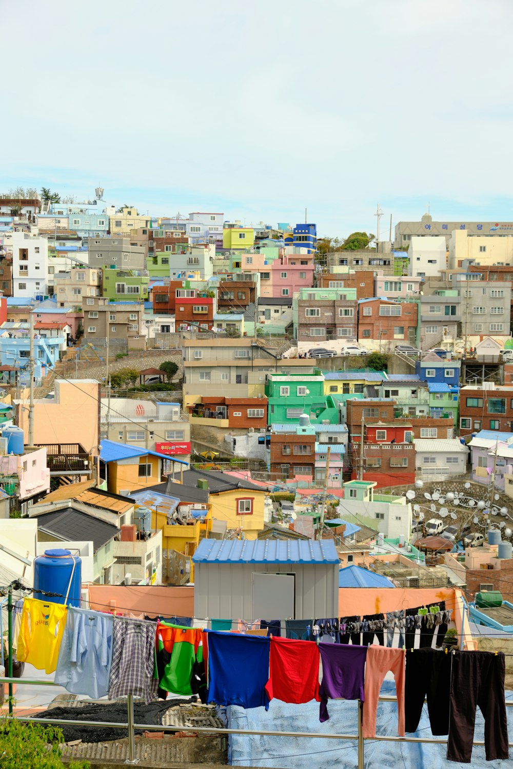 clothes hanging out to dry in front of a cityscape