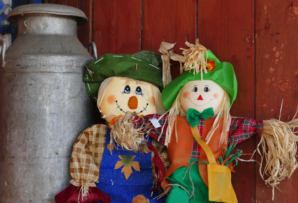 a couple of scarecrows sitting next to each other