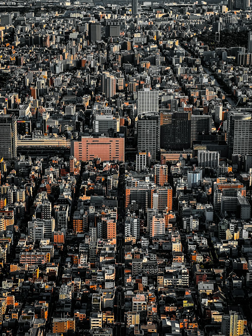 an aerial view of a city with tall buildings