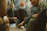 A group of friends deeply engaged in a strategic board game at a modern, minimalist club.
