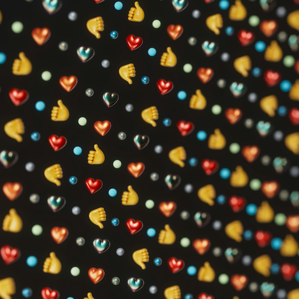 a close up of a bunch of hearts on a black background