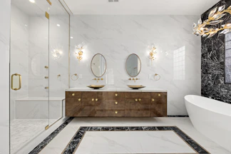 a bathroom with two sinks and a bathtub