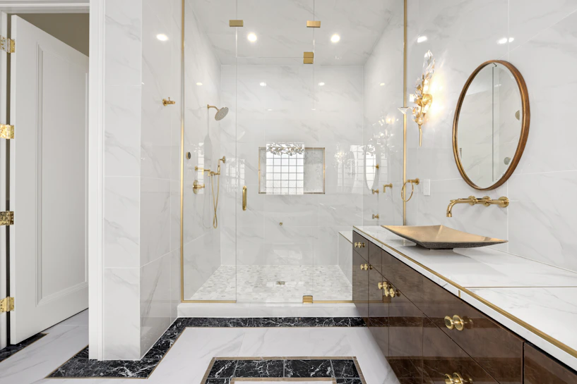 Luxurious bathroom vanity with gold accents and a large mirror