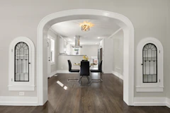 a dining room with a table and chairs in it