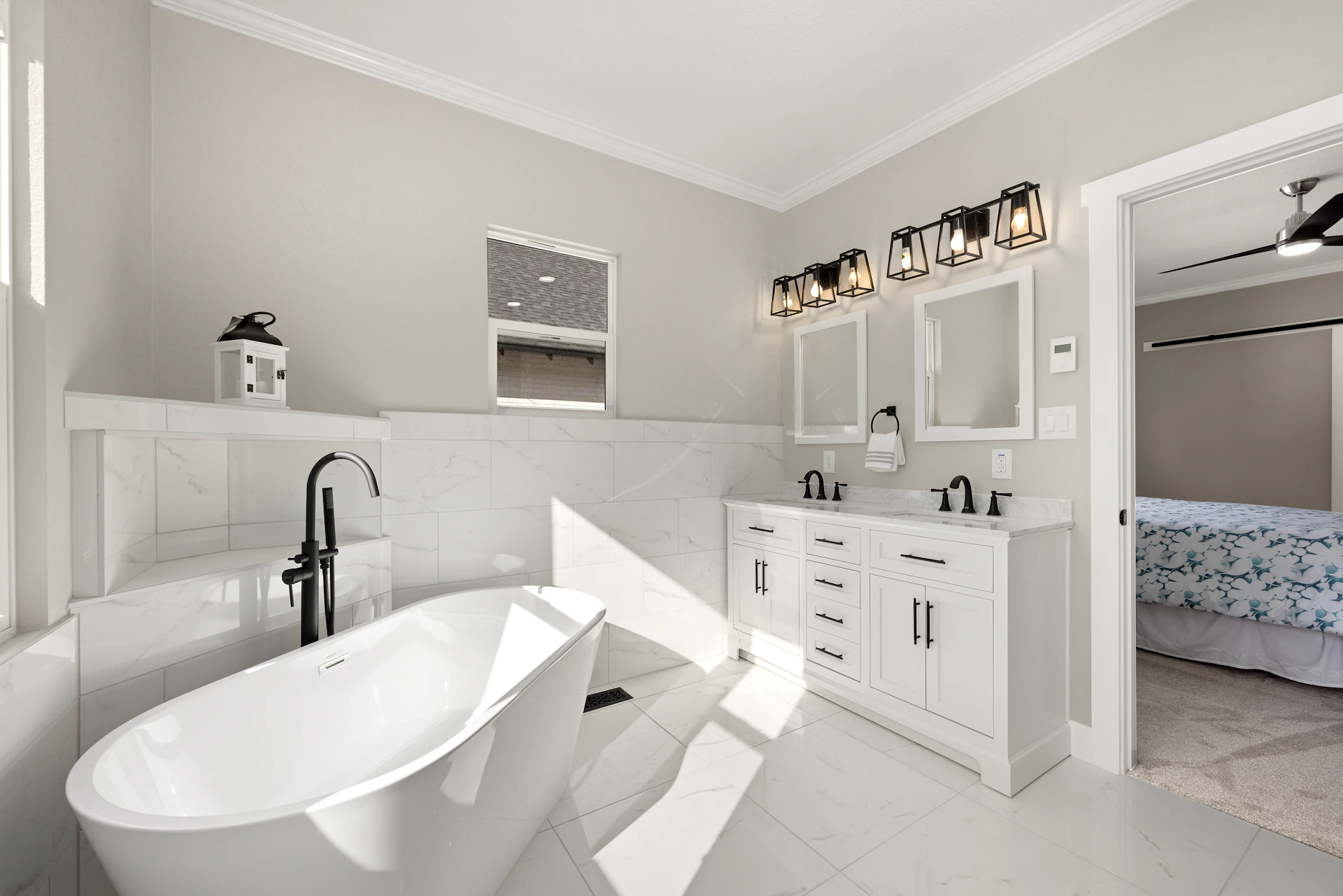 a bathroom with a tub, sink, and mirror