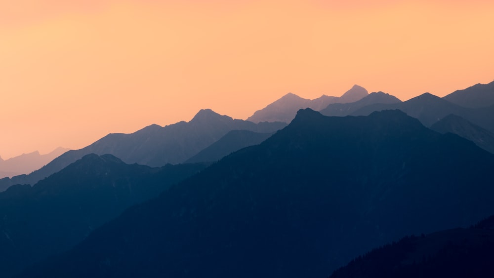 a view of a mountain range at sunset