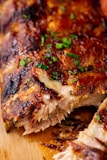 a close up of a piece of meat on a cutting board