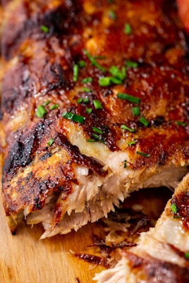 a close up of a piece of meat on a cutting board