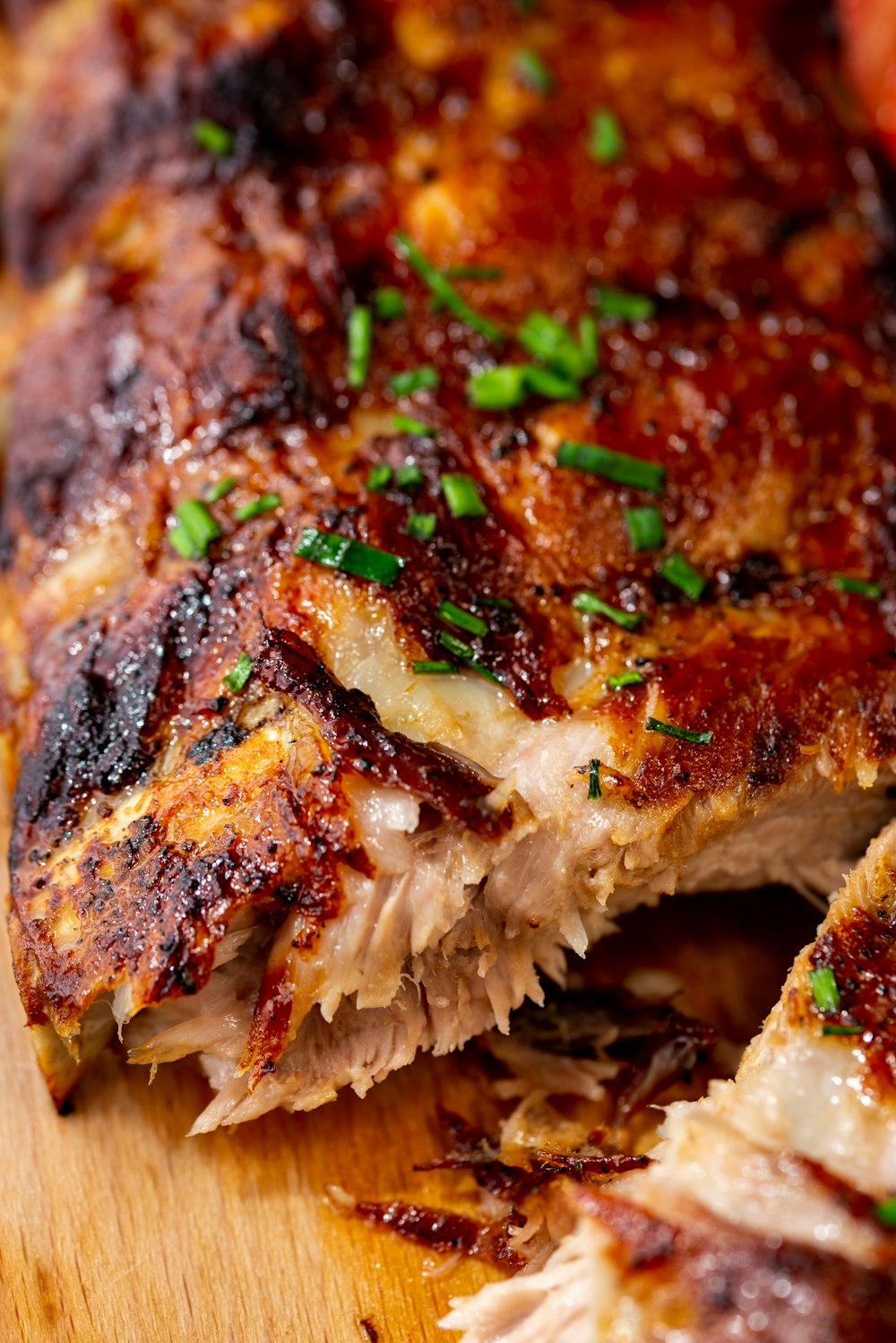 a close up of a piece of meat on a cutting board