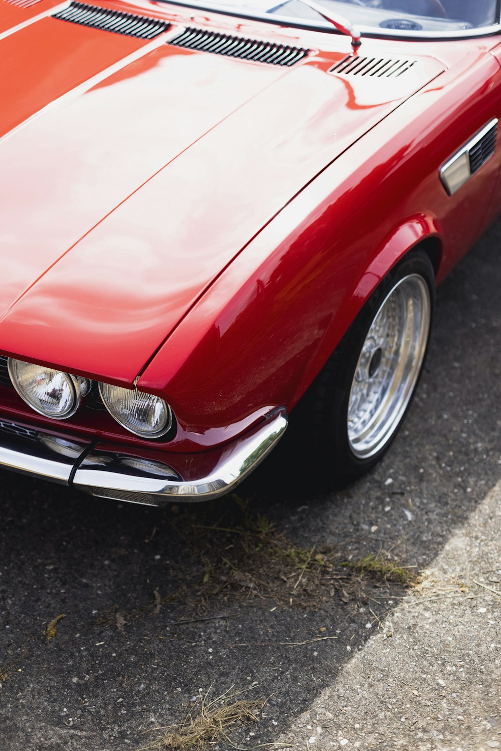 a red car parked on the side of the road