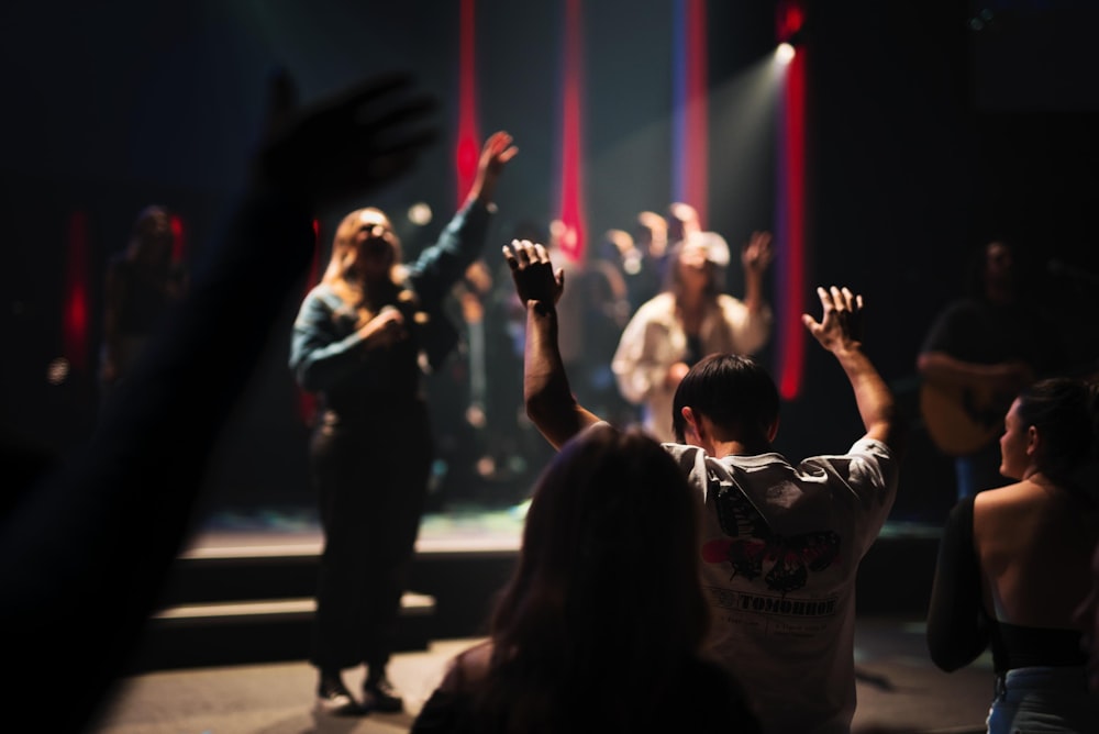 a group of people standing on top of a stage