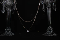 Elegant gemstone figurines catching the light with delicate gold accents.