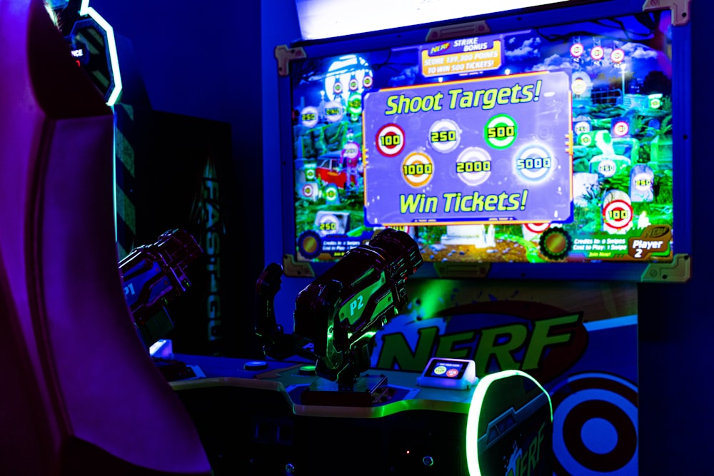 a gaming room with a big screen tv and neon lights