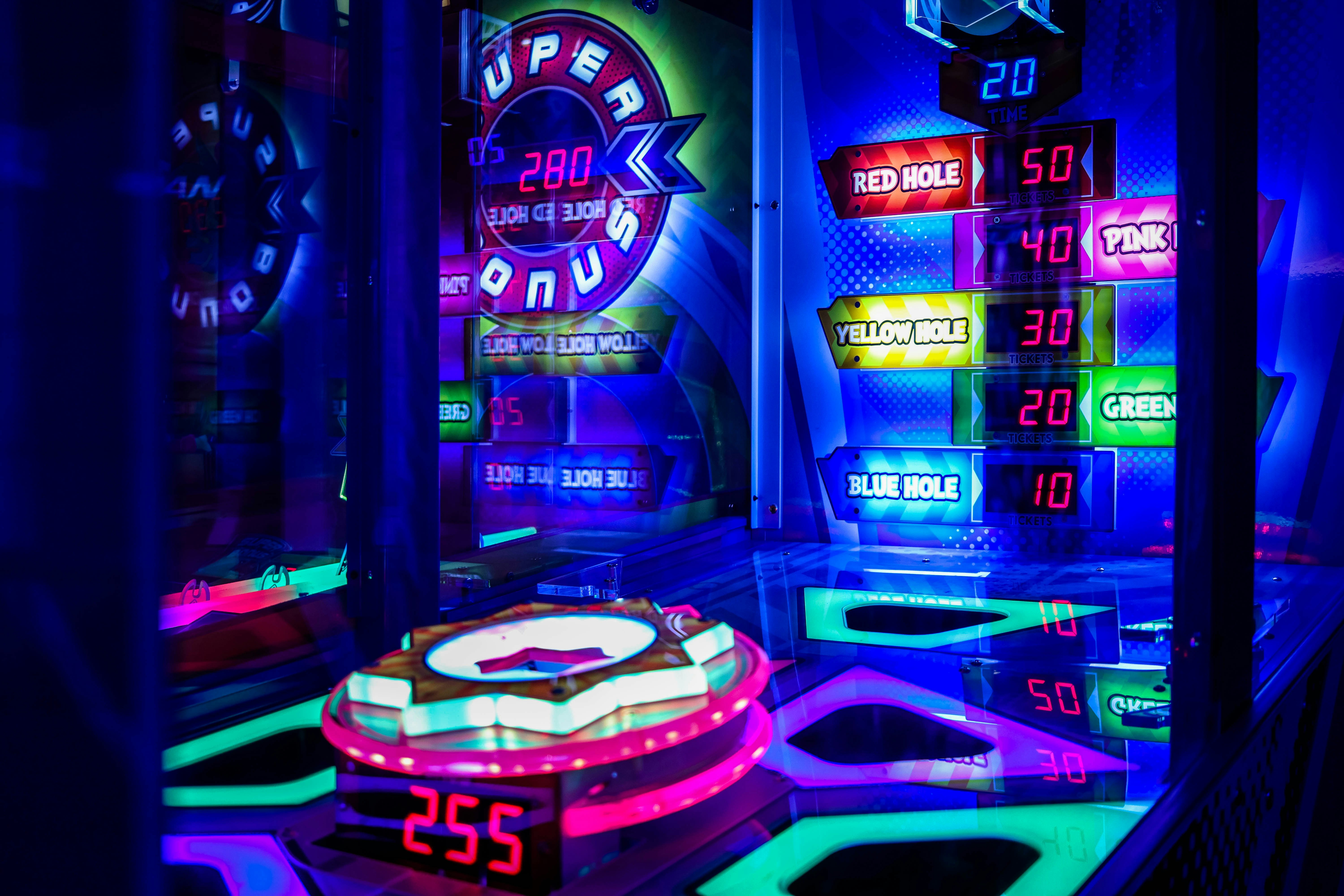 a brightly lit room with neon signs and neon lights