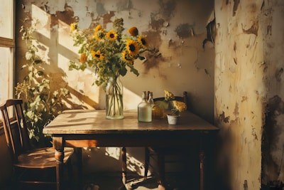 A cozy room featuring a mix of vintage wooden chairs and a rustic table bathed in warm sunlight.