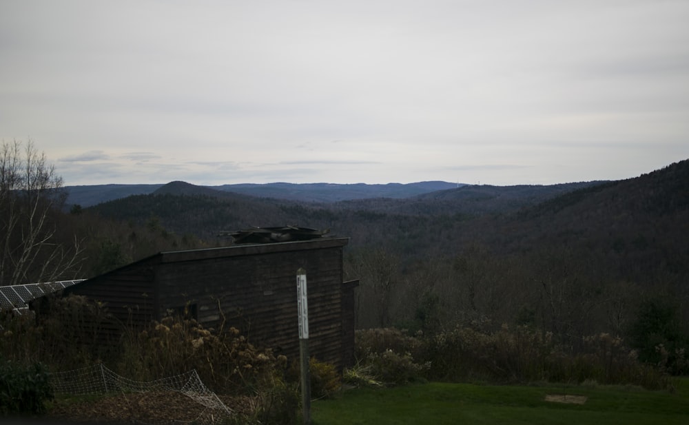 a view of a mountain range with a building in the foreground