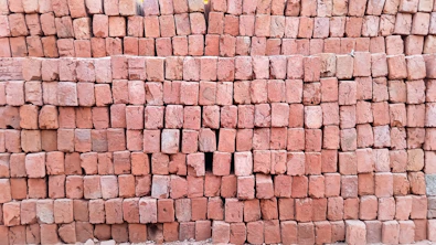 Neatly arranged pallets of smooth, uniform bricks ready for delivery