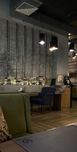 Cozy café interior adorned with subtle, elegant metal décor pieces that bring warmth and style to the walls.