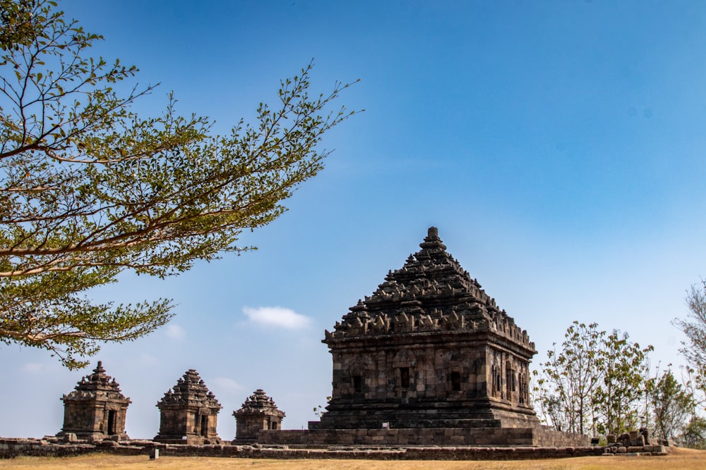 a large stone structure sitting in the middle of a field