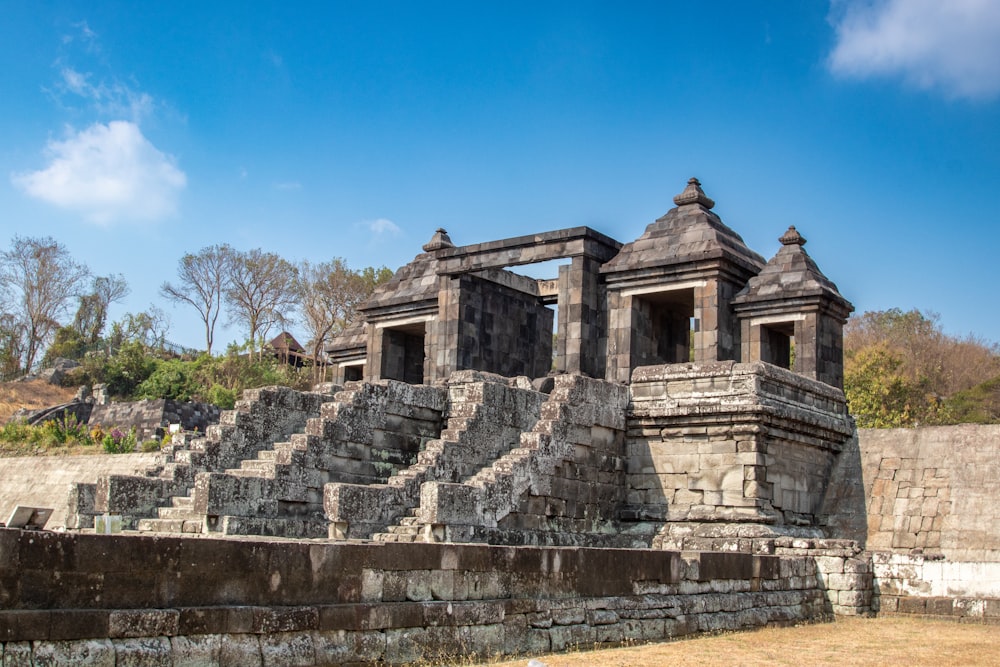 a stone structure with two towers on top of it