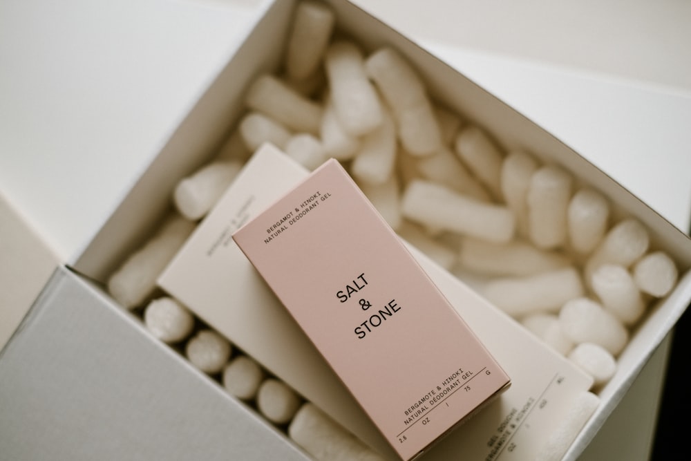 a box filled with white and pink marshmallows