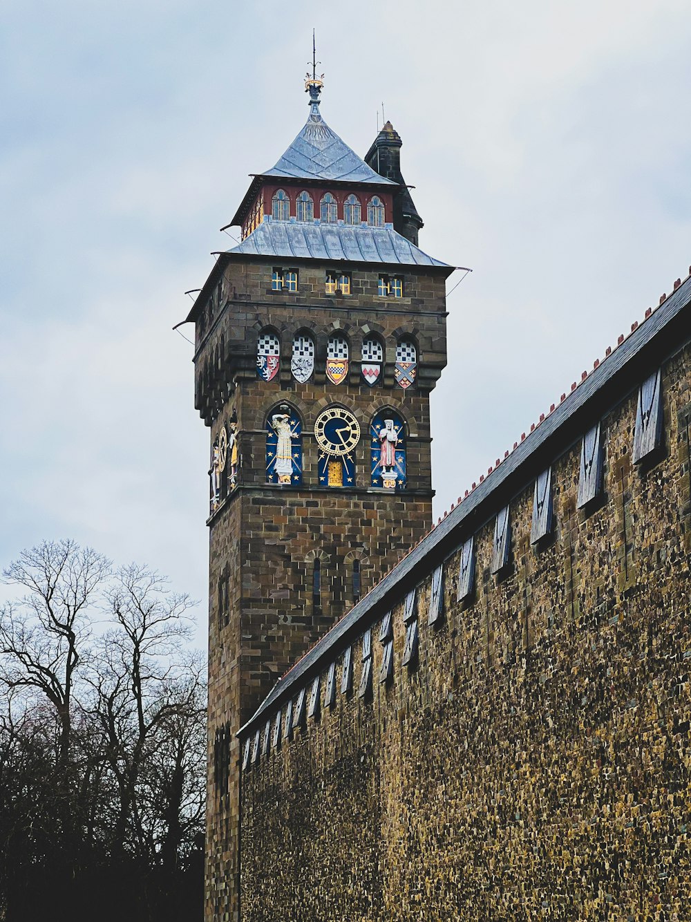 a tall tower with a clock on the side of it