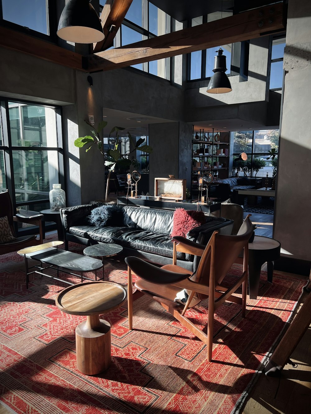 a living room filled with furniture and lots of windows