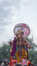 An artistic depiction of Manmatha wielding his sugarcane bow with flower-tipped arrows, surrounded by blooming lotuses.