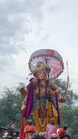 An artistic depiction of Manmatha wielding his sugarcane bow with flower-tipped arrows, surrounded by blooming lotuses.