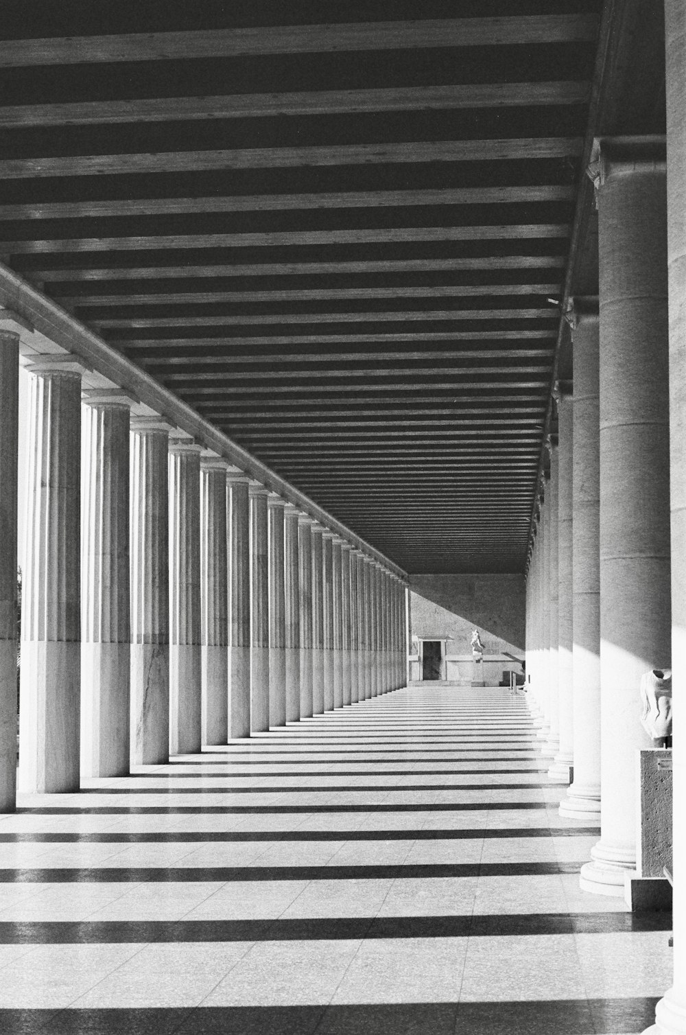 a black and white photo of columns in a building