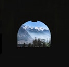 a view of a mountain range through a window