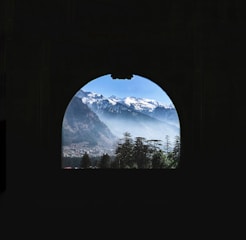 a view of a mountain range through a window