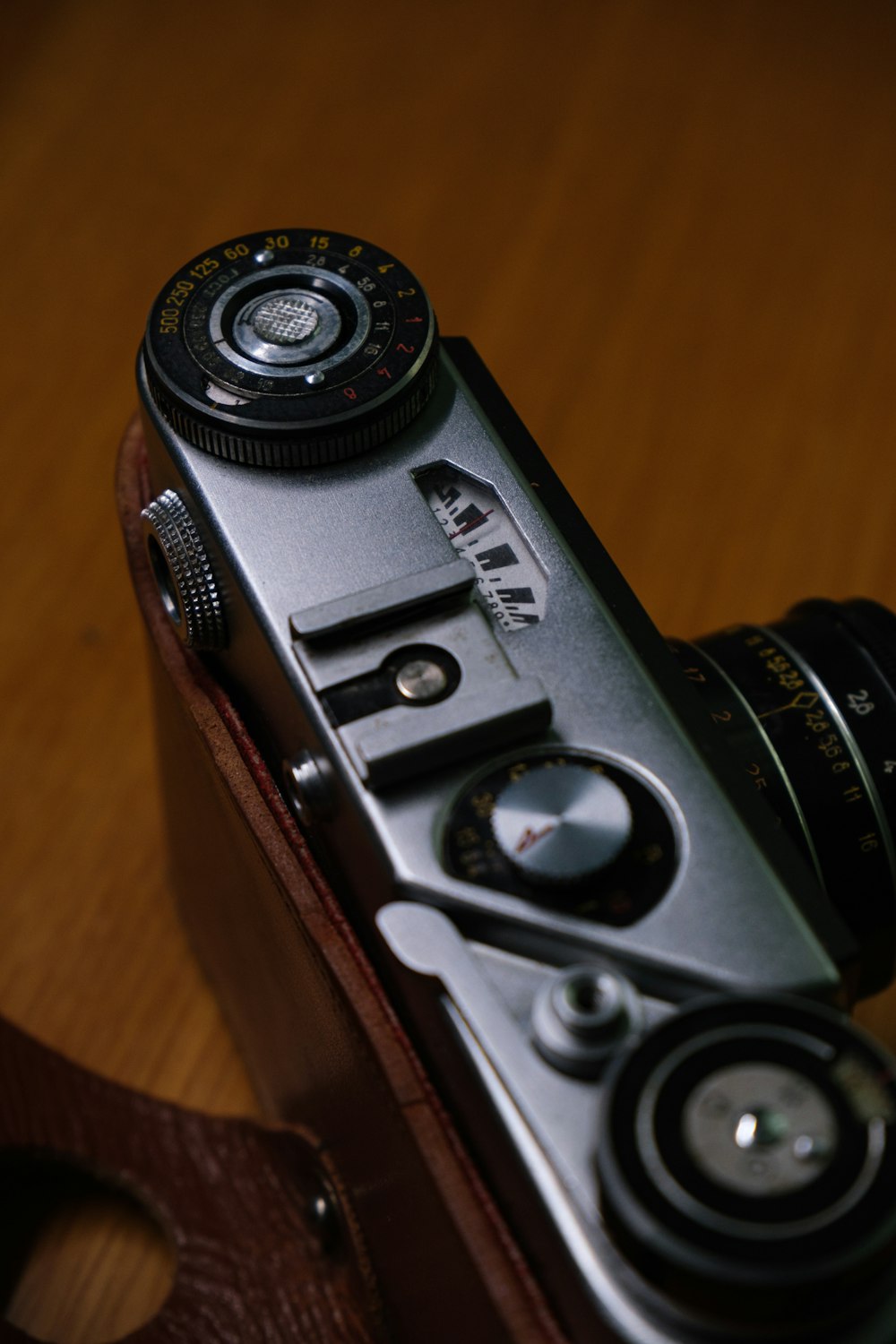 a camera sitting on top of a wooden table