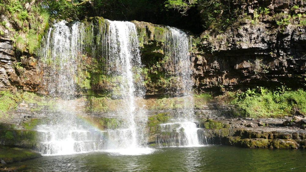 a large waterfall with lots of water coming out of it