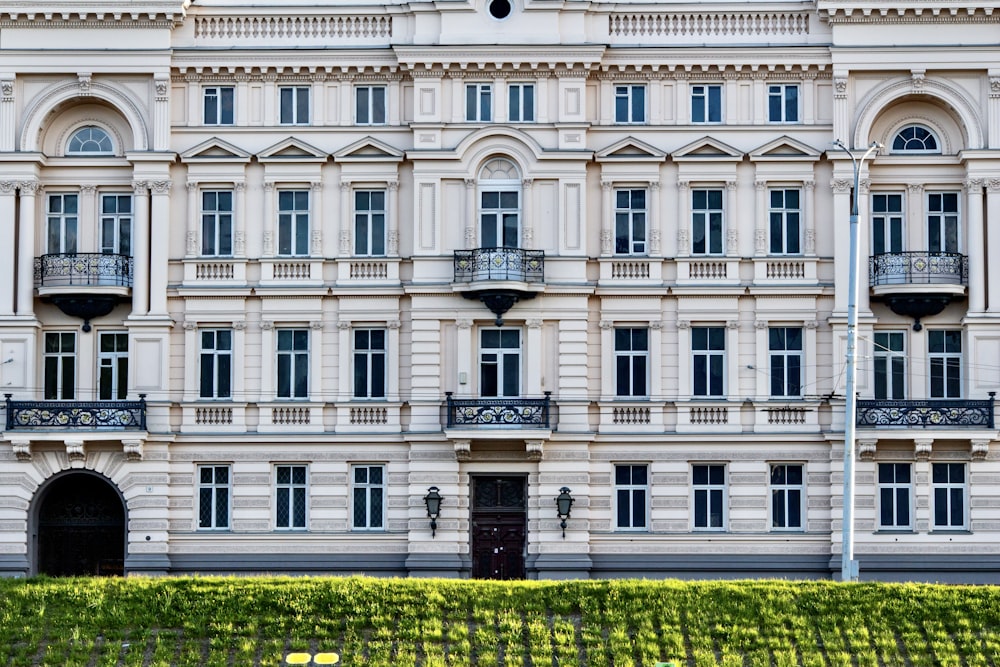 a large white building with many windows and balconies