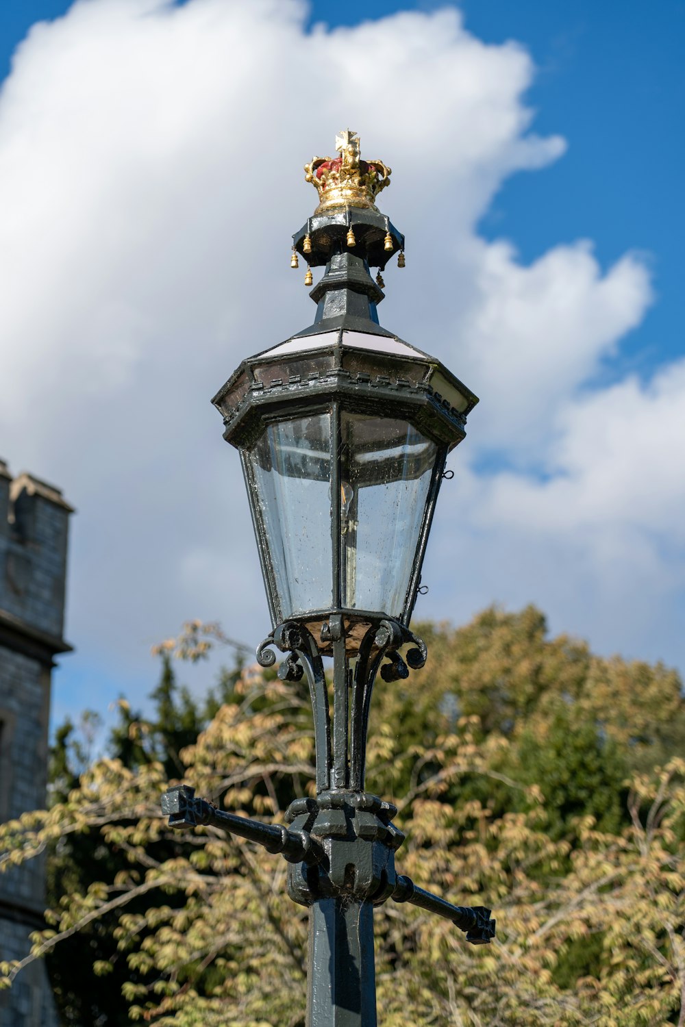 a street light with a crown on top of it