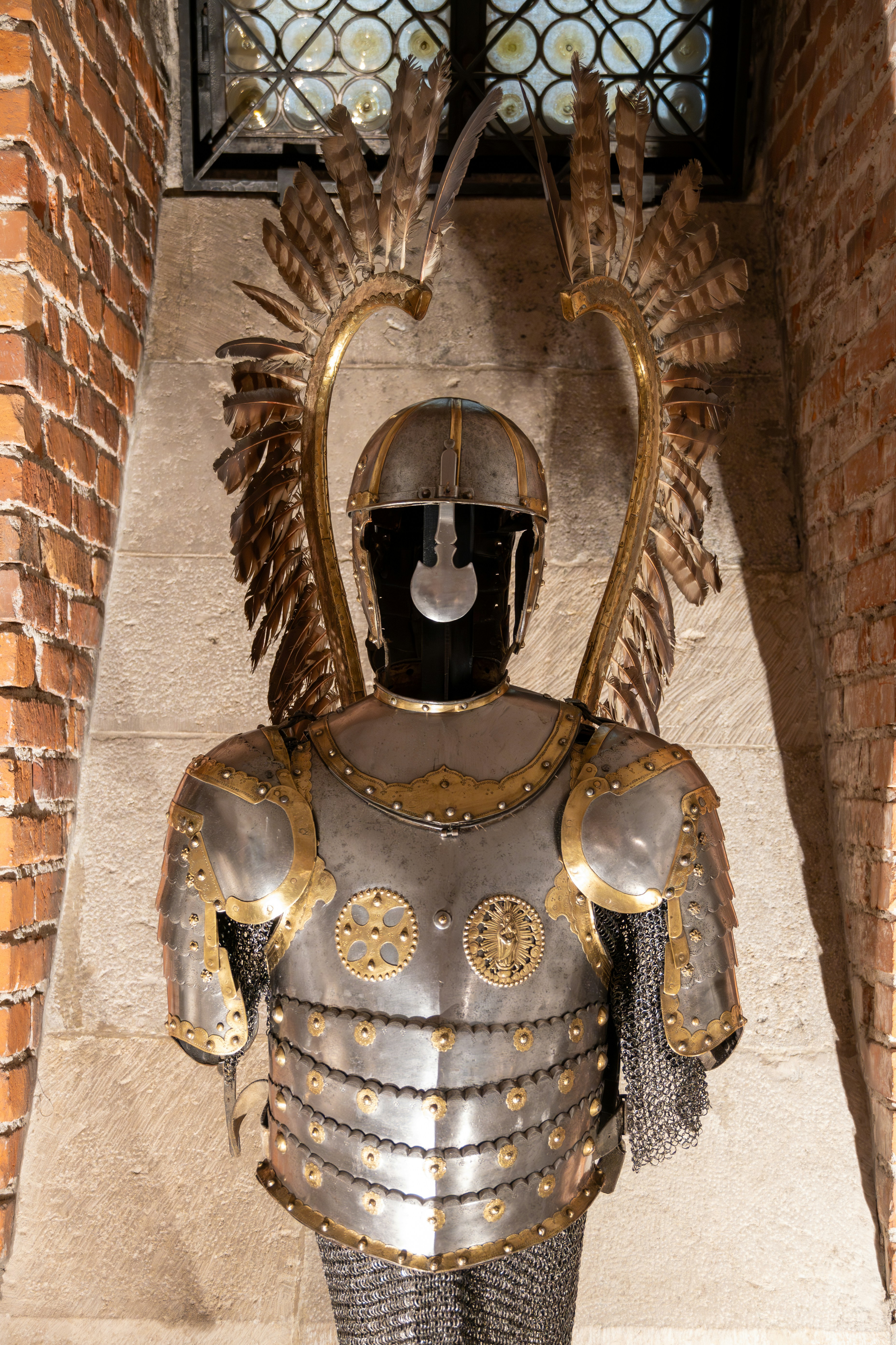 a statue of a knight with a helmet and armor