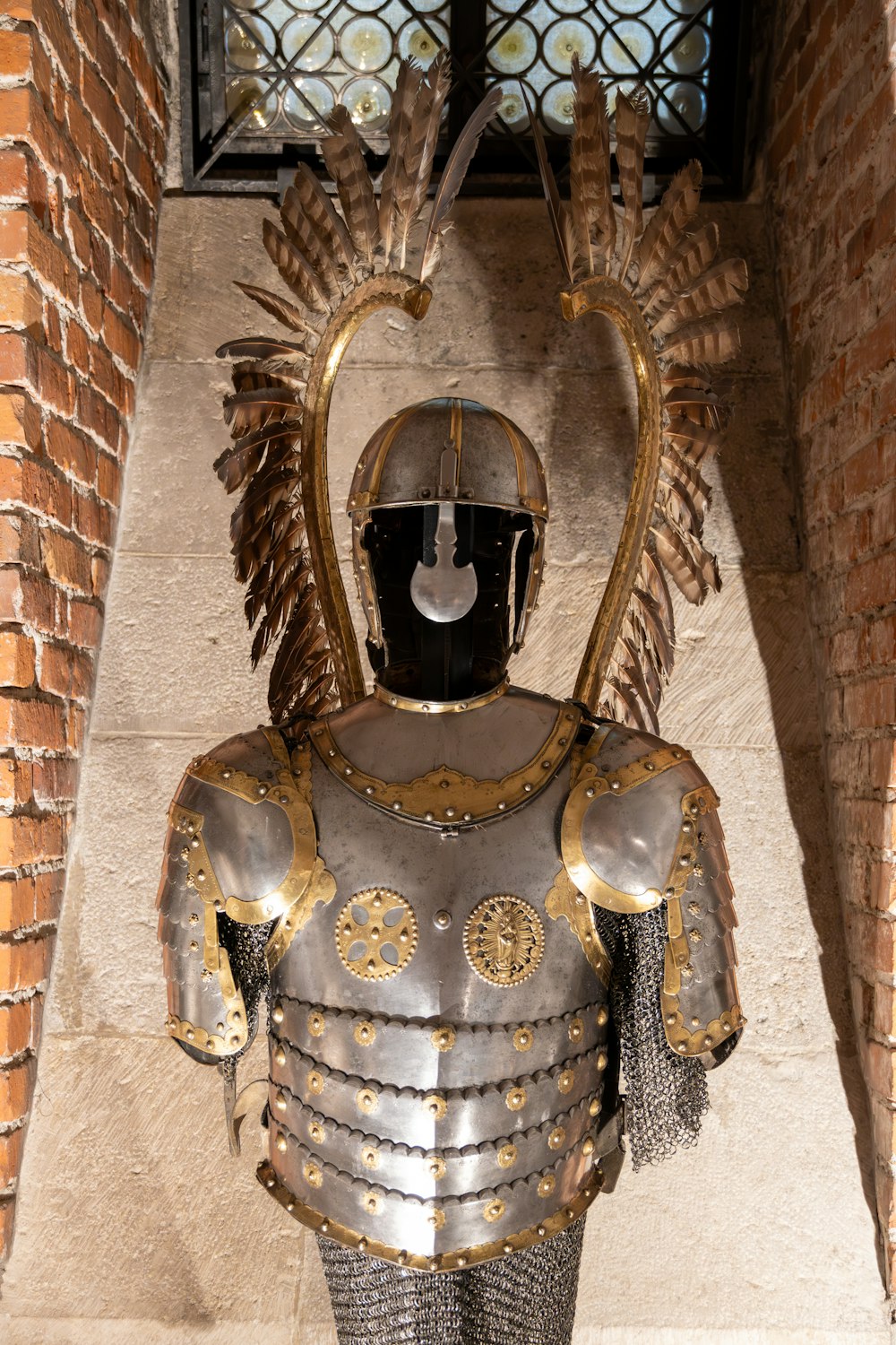 a statue of a knight with a helmet and armor