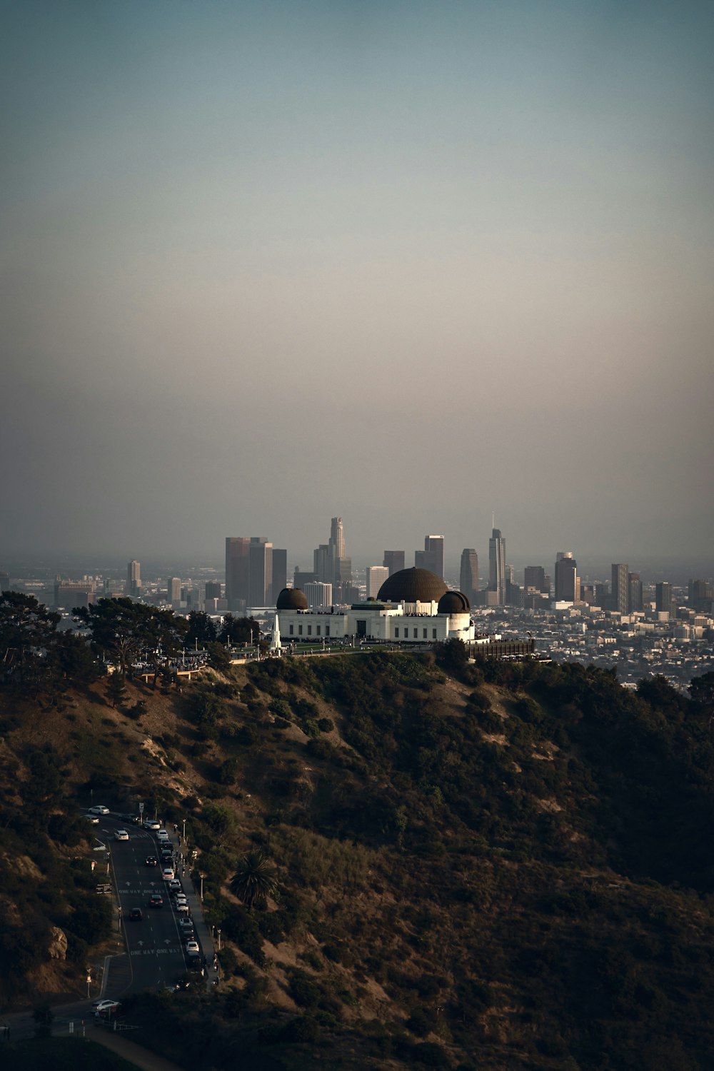 a view of a city from the top of a hill