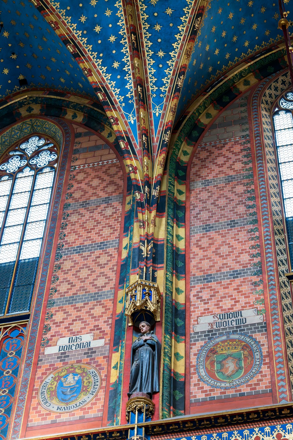 a statue in the middle of a colorful building