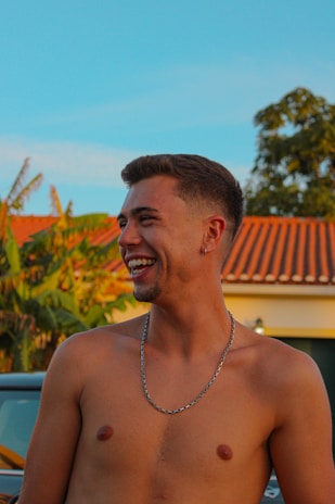 Happy customer wearing a stylish cord necklace outdoors.