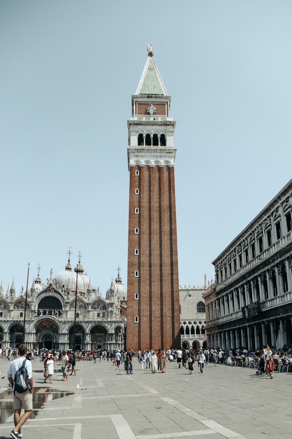 a tall clock tower towering over a city