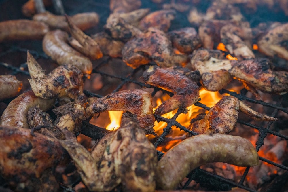 a close up of food cooking on a grill