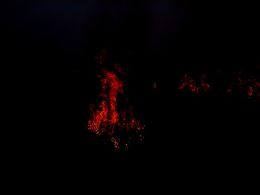 Community of dark meme enthusiasts surrounded by fiery hellish background.