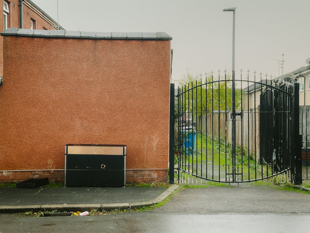 a black box sitting in front of a gate