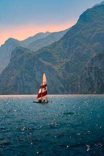 Close-up of a classic wooden sailboat cutting through Bear Lake’s clear blue water.