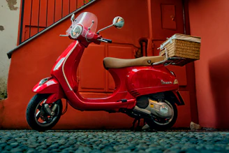 Electric scooter being delivered to a stylish Marrakech riad entrance.